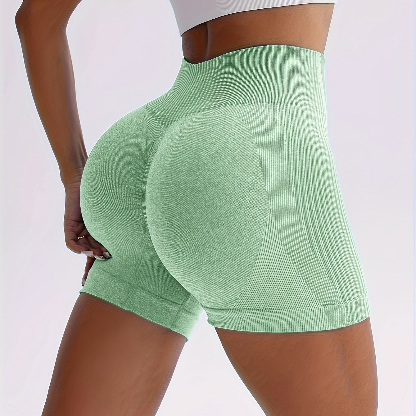 New Seamless High-Waisted Peach Butt Yoga Shorts for Women, Perfect for Fitness, Running, And Sports, with a Three-Quarter Length.