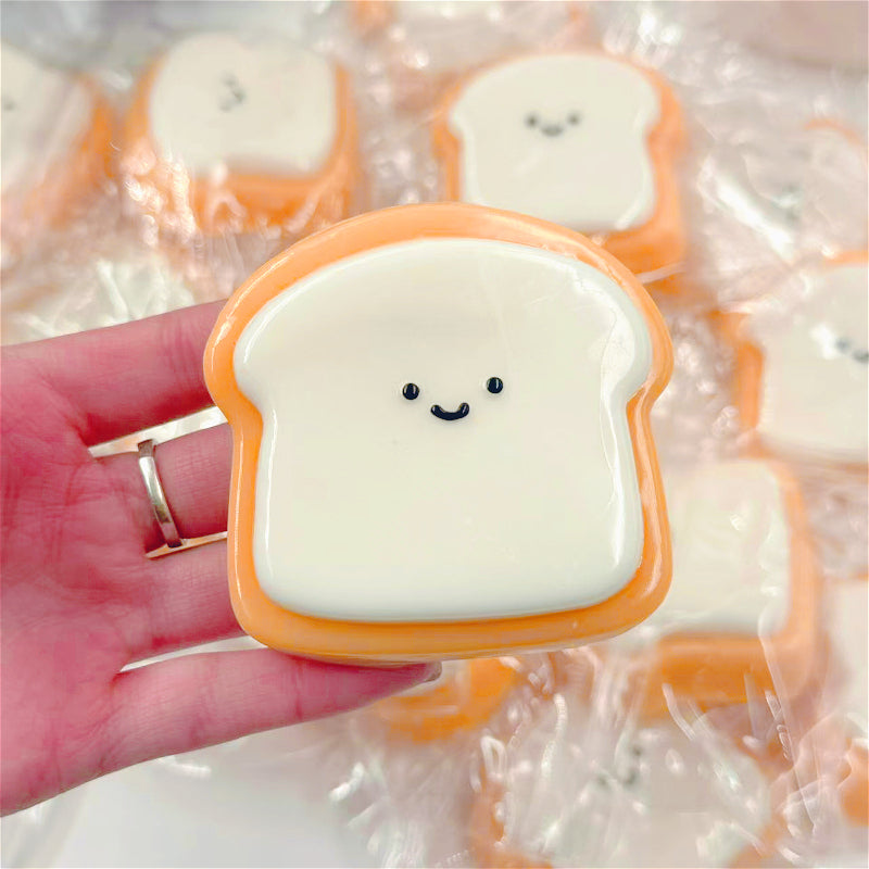 [Squishy Toast Toy] Ultra-Soft 1pc Squishy Toast Relax Toy | Adorable Smiling Face Design, Slow Rebound, Easy to Clean, Synthetic Rubber, Multicolor (White & Orange), Playful Desk Accessory